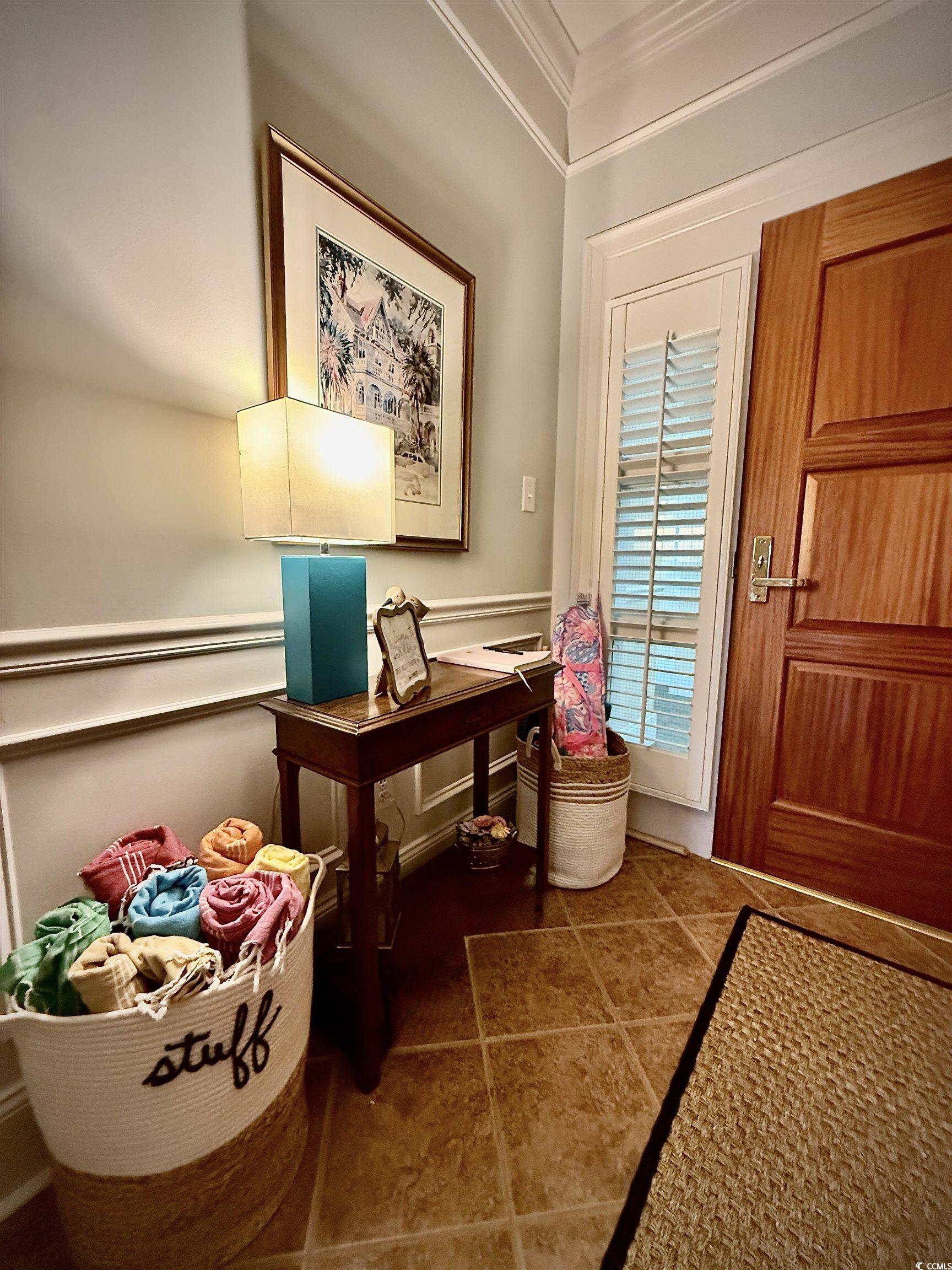 1330 Villa Marbella Court, Unit 303 Myrtle Beach, SC 29572 - Photo 32 of 40 Entryway featuring ornamental molding and tile patterned flooring