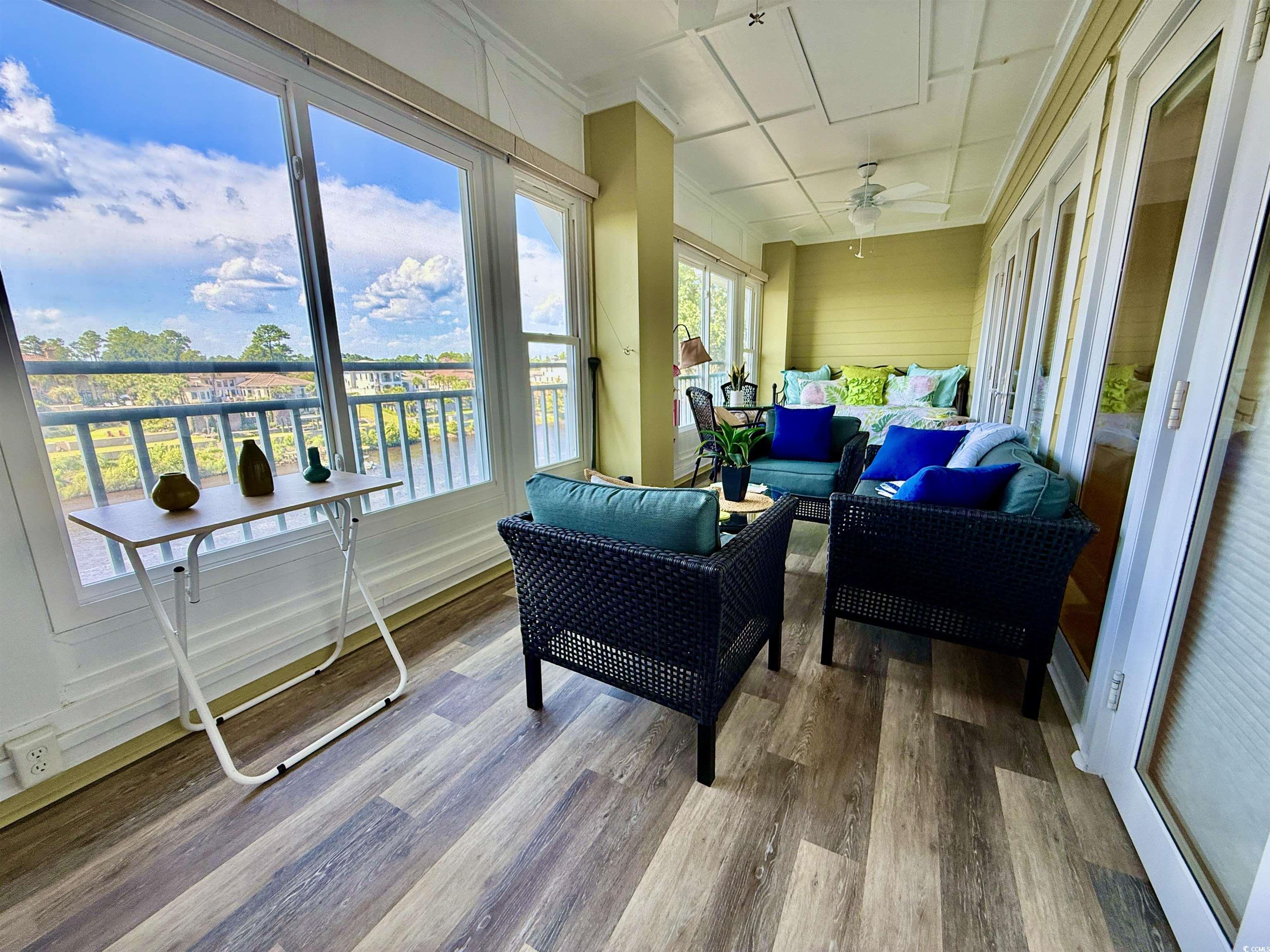 1330 Villa Marbella Court, Unit 303 Myrtle Beach, SC 29572 - Photo 10 of 40 Sunroom with outdoor lounge area and ceiling fan