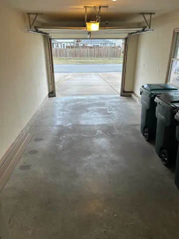 a view of a garage with wooden floor