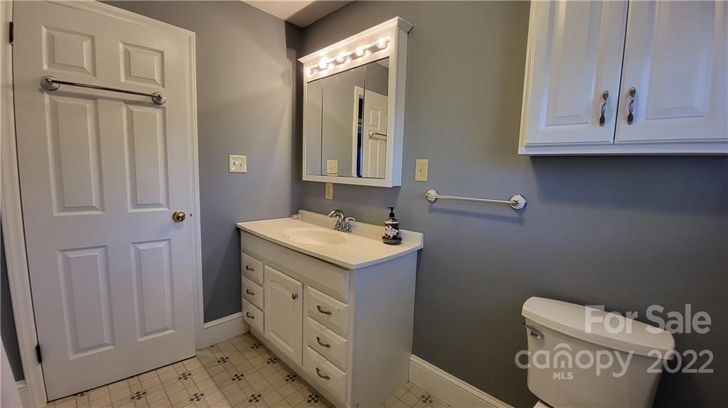 3518 Upper White Store Road Peachland, NC 28133 - Photo 24 of 33 a bathroom with a sink toilet and mirror