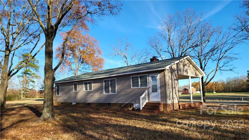 3518 Upper White Store Road Peachland, NC 28133 - Photo 3 of 33 a front view of a house with a yard