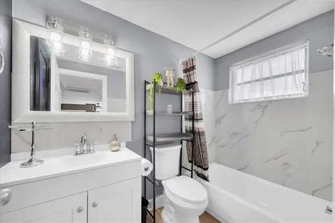 a kitchen with stainless steel appliances granite countertop a refrigerator sink and stove