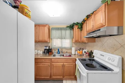 a view of a livingroom with furniture and a flat screen tv