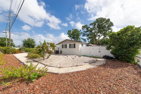 a view of a backyard with a sitting area
