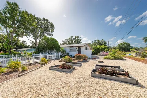 a view of a pathway with a wrought fence