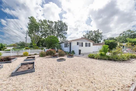 a view of a wrought iron fences in front of house