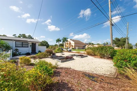 a view of a house with a snow in the yard