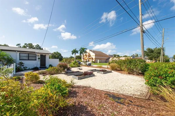 a view of a house with a snow in the yard