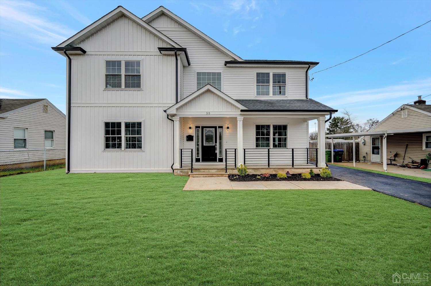55 Walnut Street Edison, NJ 08817 - Photo 1 of 40 a front view of a house with a yard and patio