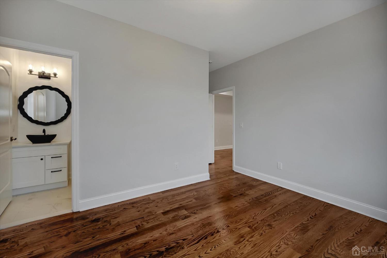 55 Walnut Street Edison, NJ 08817 - Photo 17 of 40 a view of room with wooden floor