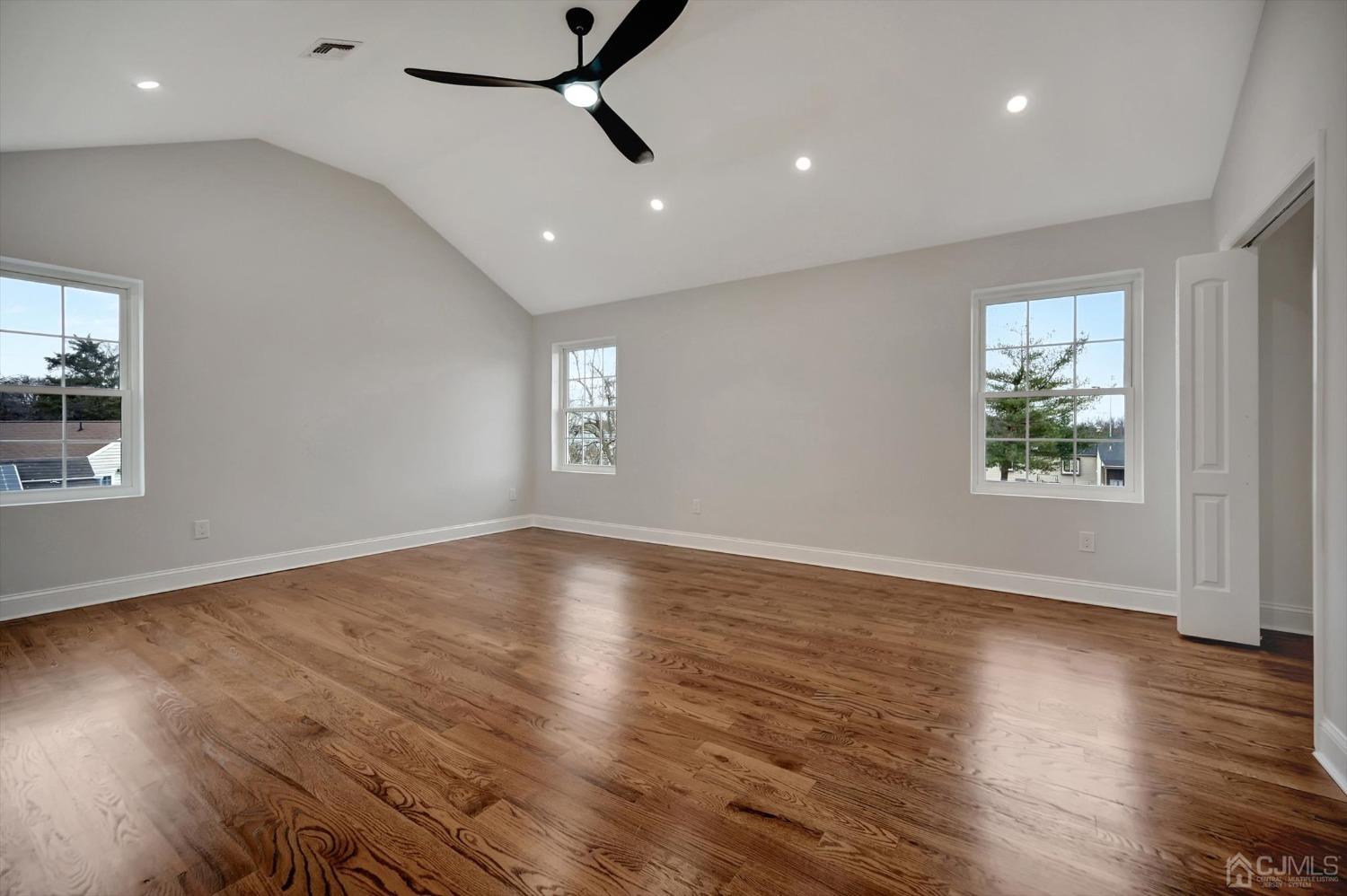 55 Walnut Street Edison, NJ 08817 - Photo 20 of 40 an empty room with wooden floor and windows
