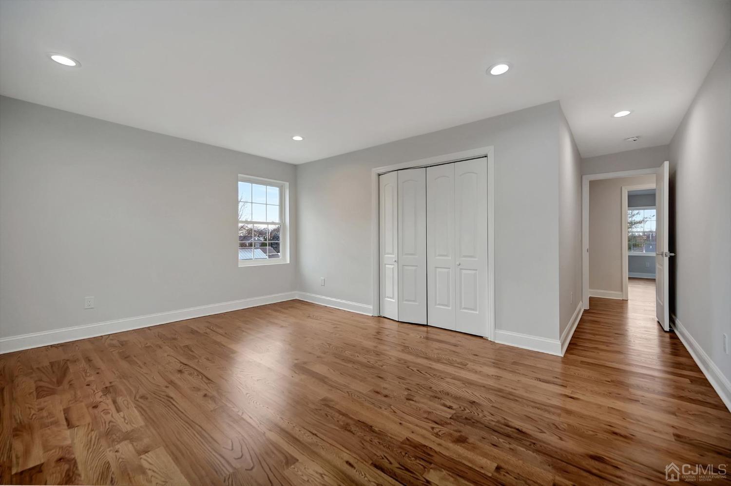 55 Walnut Street Edison, NJ 08817 - Photo 25 of 40 a view of an empty room with wooden floor and a window