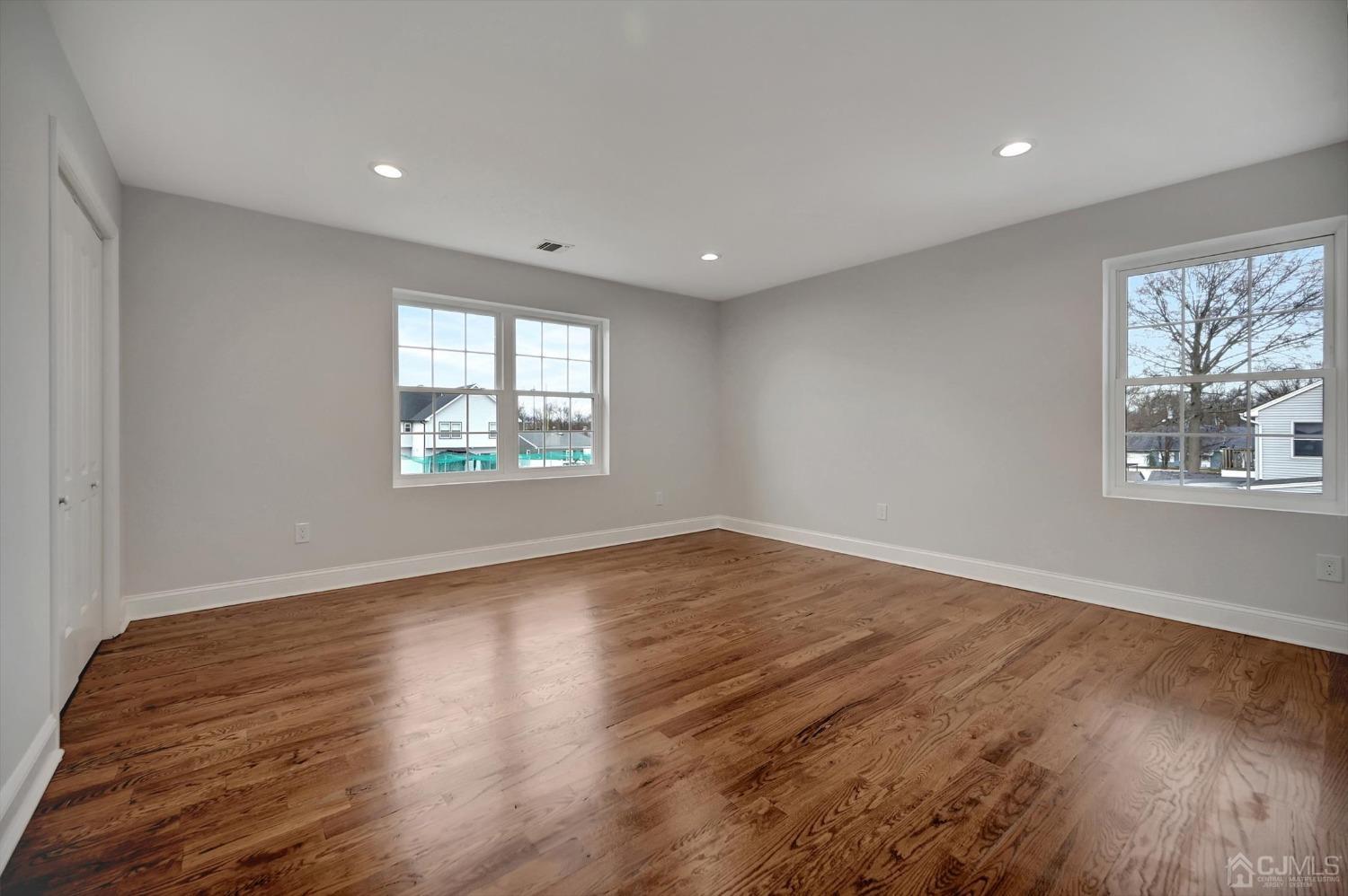55 Walnut Street Edison, NJ 08817 - Photo 26 of 40 wooden floor in an empty room with a window