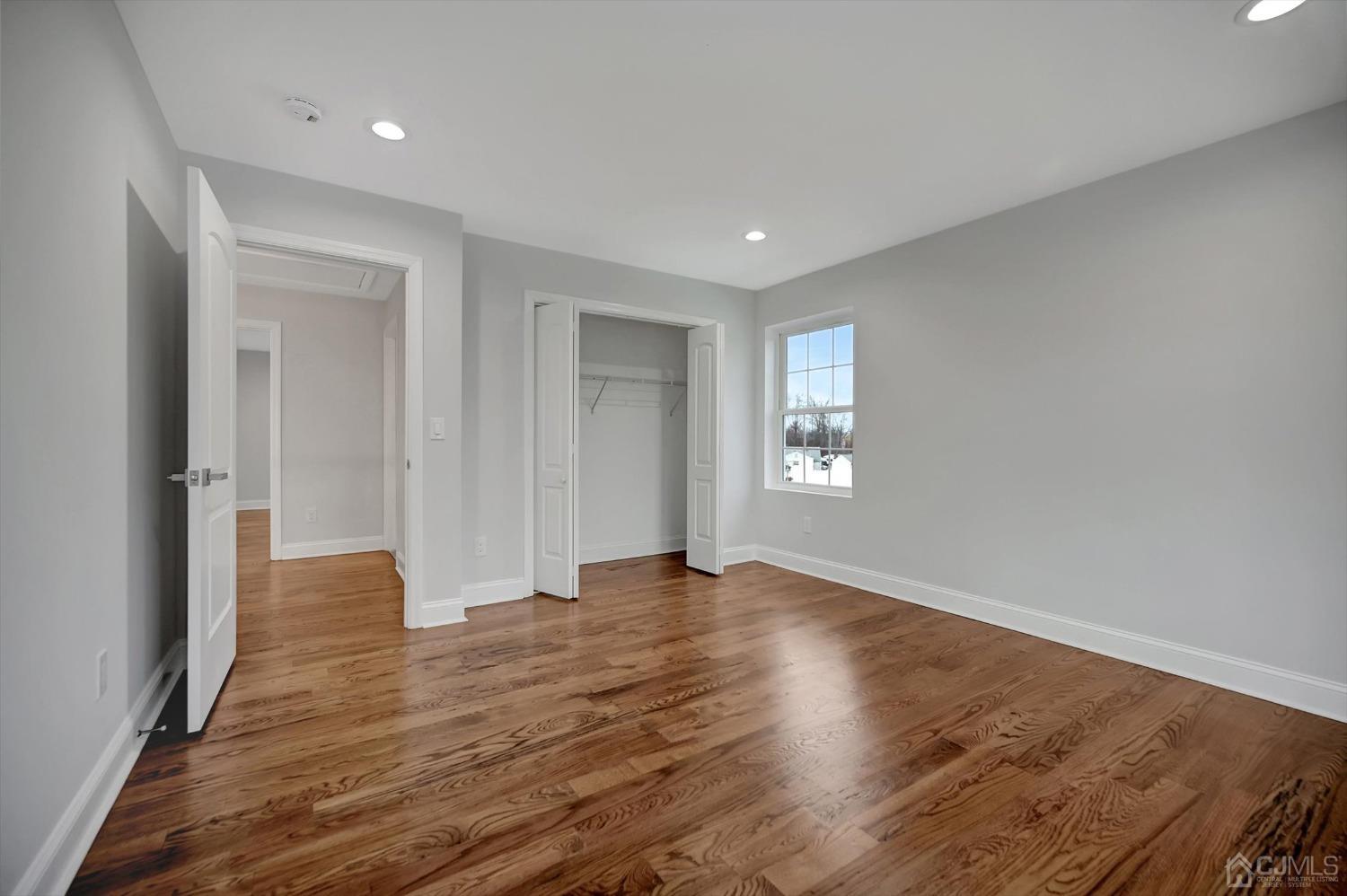 55 Walnut Street Edison, NJ 08817 - Photo 28 of 40 a view of an empty room with wooden floor and a window