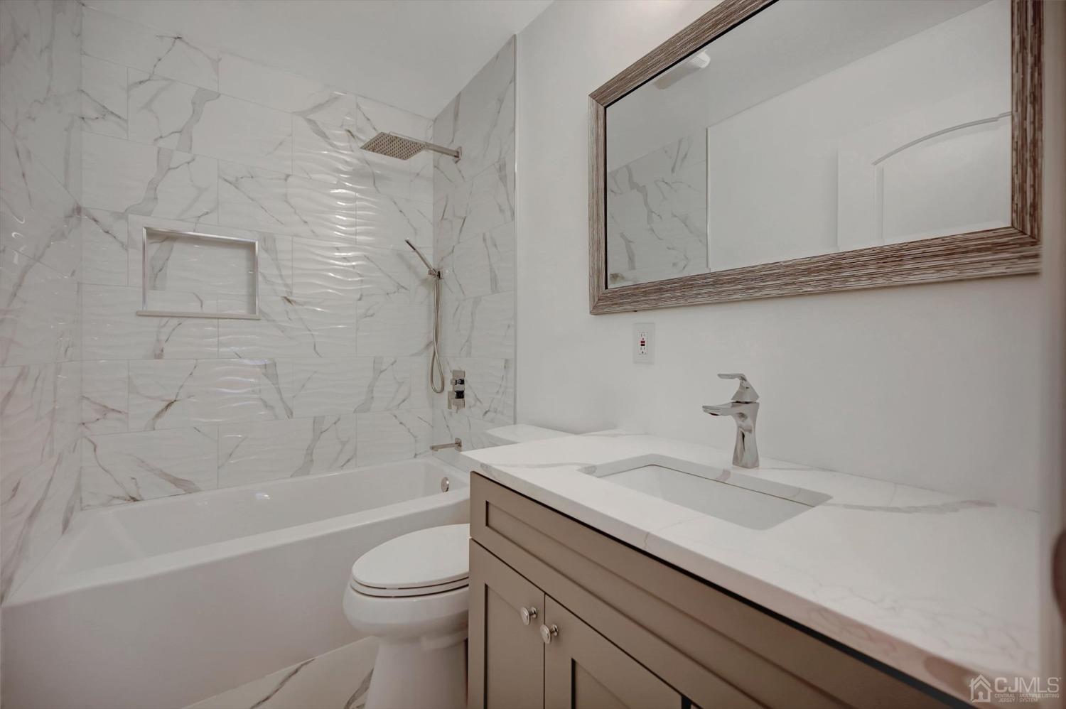 55 Walnut Street Edison, NJ 08817 - Photo 29 of 40 a bathroom with a sink a toilet and shower