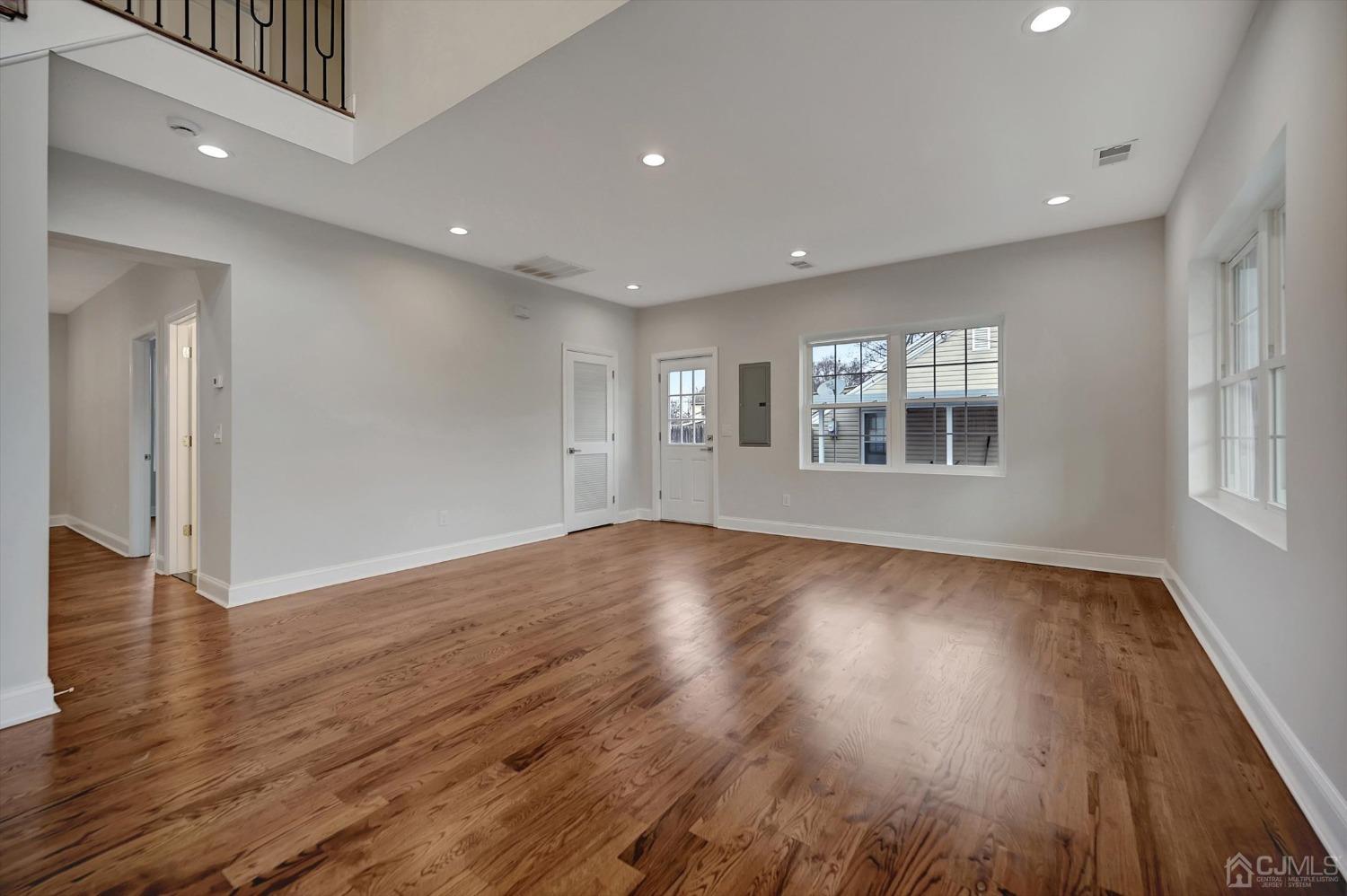 55 Walnut Street Edison, NJ 08817 - Photo 3 of 40 a view of empty room with wooden floor and fan
