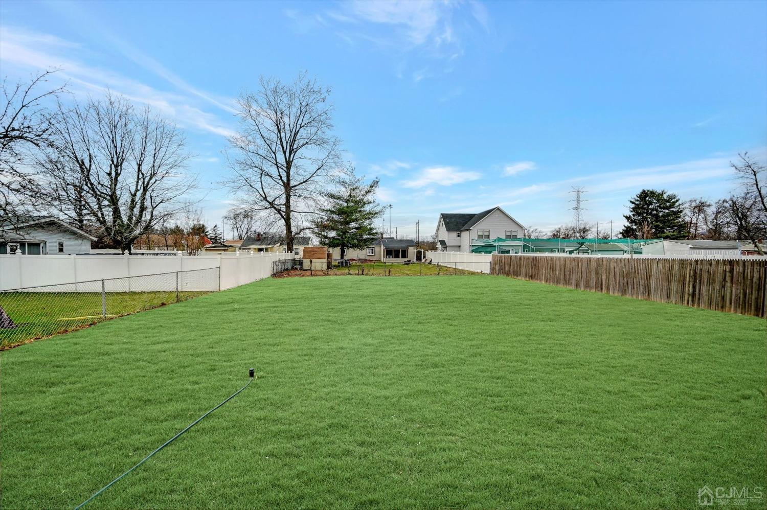 55 Walnut Street Edison, NJ 08817 - Photo 35 of 40 a view of yard with grass & fence