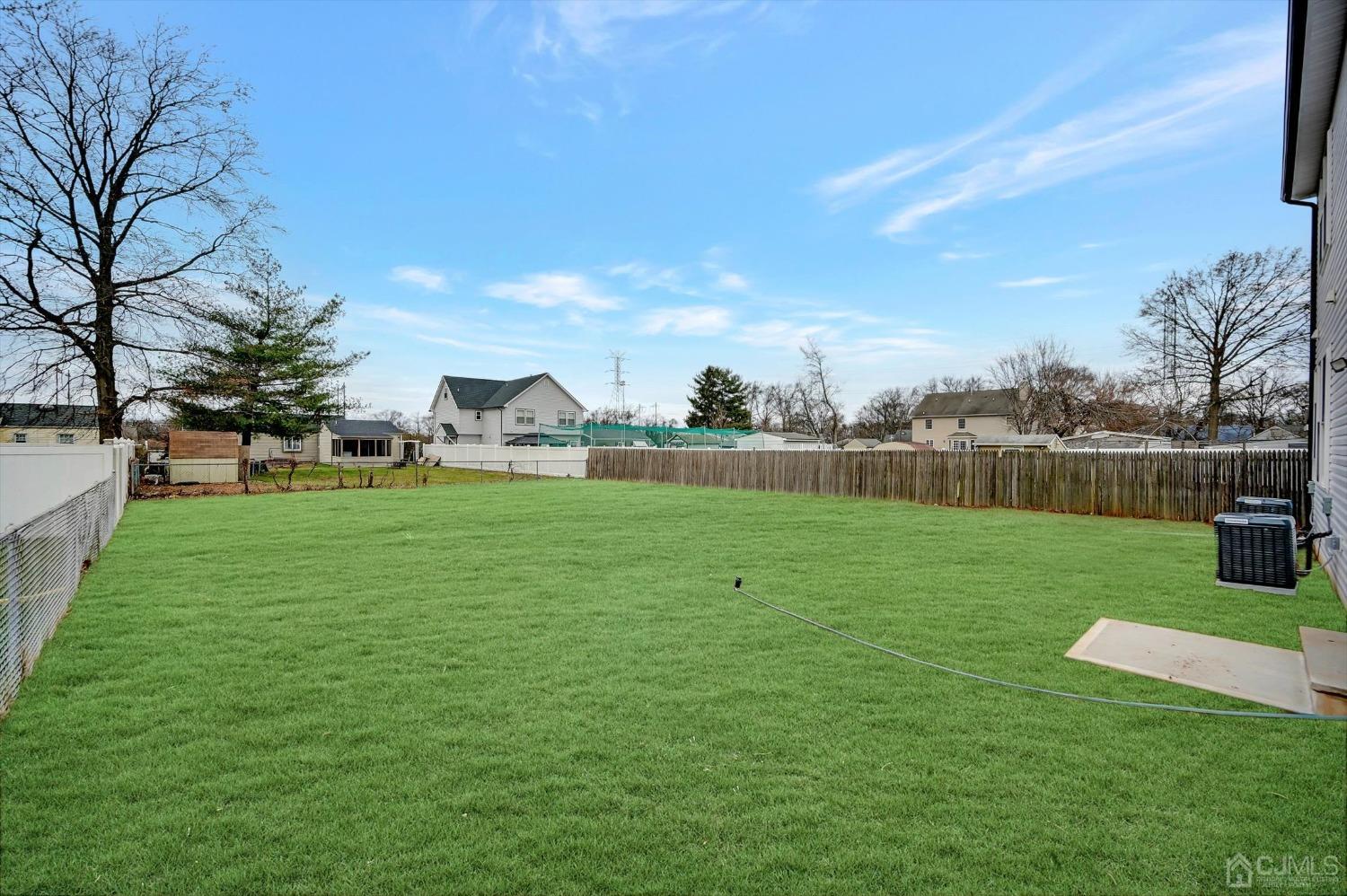 55 Walnut Street Edison, NJ 08817 - Photo 36 of 40 a view of a garden and basketball court