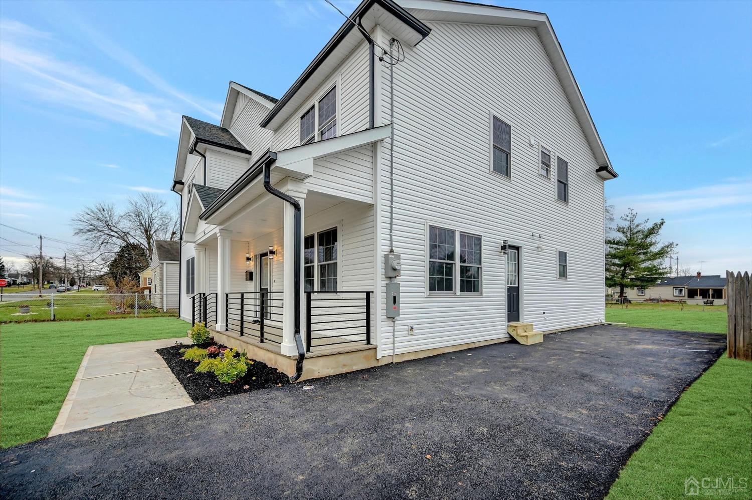 55 Walnut Street Edison, NJ 08817 - Photo 37 of 40 a view of a white house with a yard