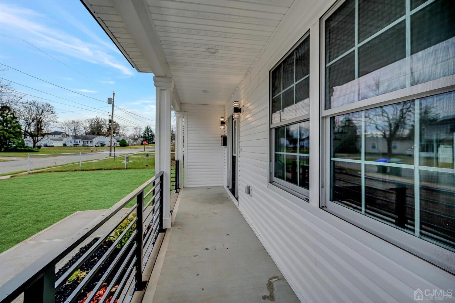 55 Walnut Street Edison, NJ 08817 - Photo 39 of 40 a view of a balcony with wooden floor and fence