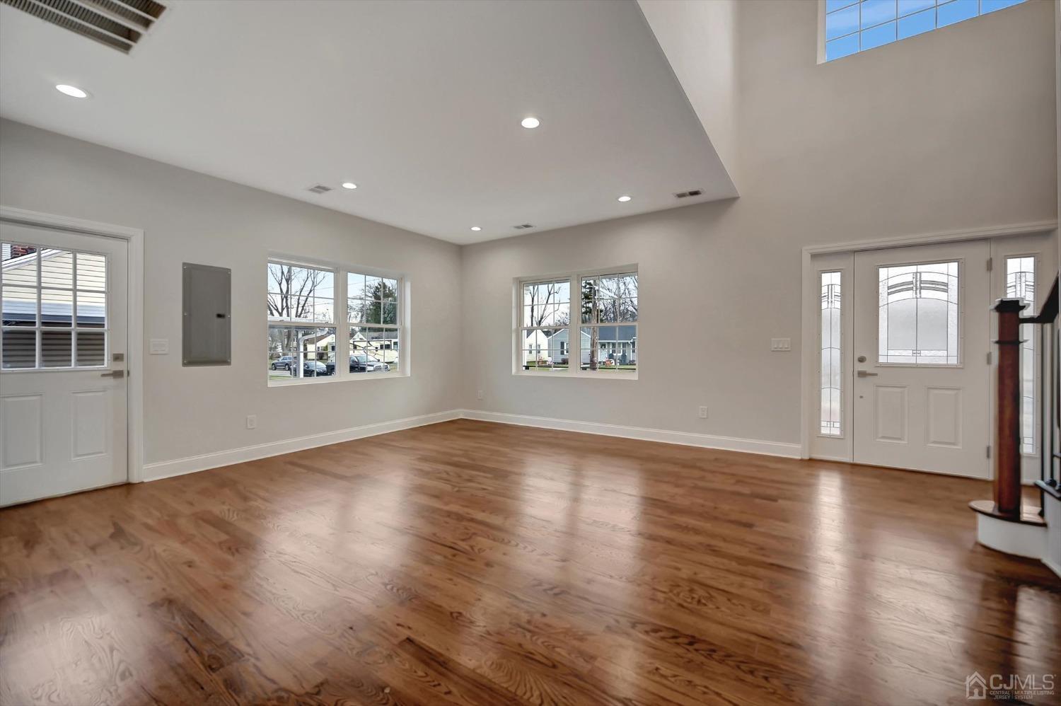 55 Walnut Street Edison, NJ 08817 - Photo 4 of 40 a view of an empty room with wooden floor and a window