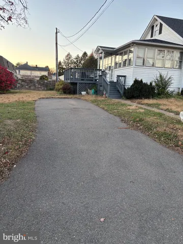 a big house with a big yard and large trees