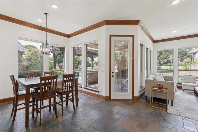 a view of a dining room with furniture window and outside view