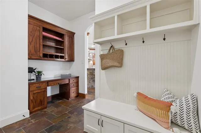 a kitchen with stainless steel appliances granite countertop a refrigerator and stove