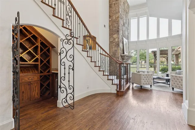 a view of entryway with wooden floor and stairs