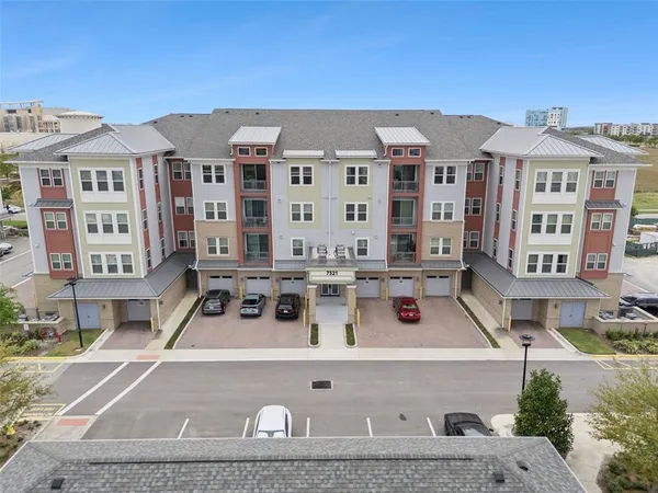 a front view of a building with parking space