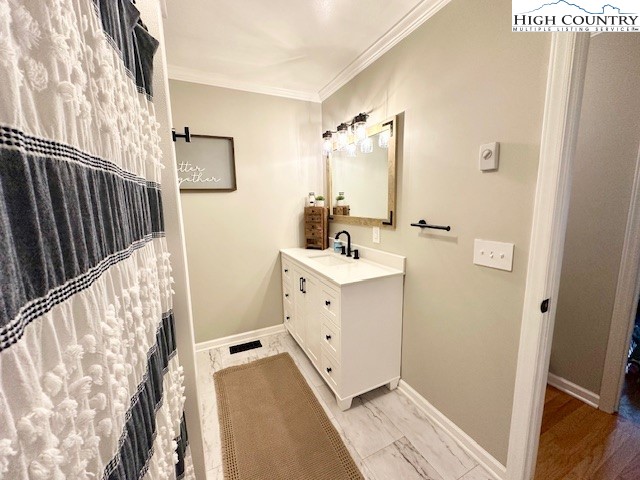 1661 Bare Creek Road Jefferson, NC 28640 - Photo 17 of 20 a bathroom with a double vanity sink a mirror and a shower