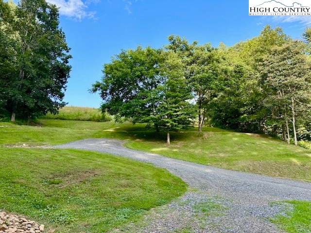 1661 Bare Creek Road Jefferson, NC 28640 - Photo 3 of 20 a view of a golf course with a big yard