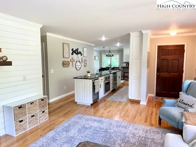 a living room with stainless steel appliances kitchen island granite countertop furniture and a kitchen view