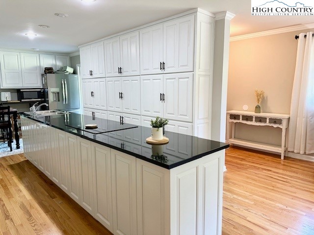 1661 Bare Creek Road Jefferson, NC 28640 - Photo 9 of 20 a kitchen with stainless steel appliances granite countertop a sink a stove and cabinets