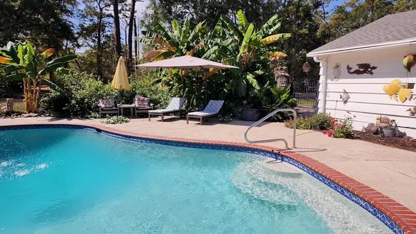 a view of a patio with swimming pool
