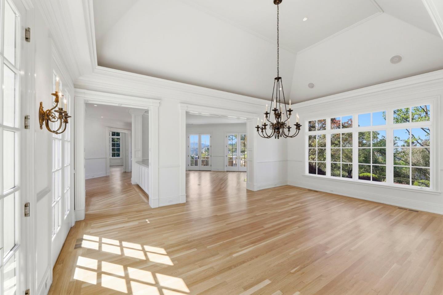 14113 Pike Road Saratoga, CA 95070 - Photo 16 of 78 a view interior of a house with wooden floor chandelier and windows