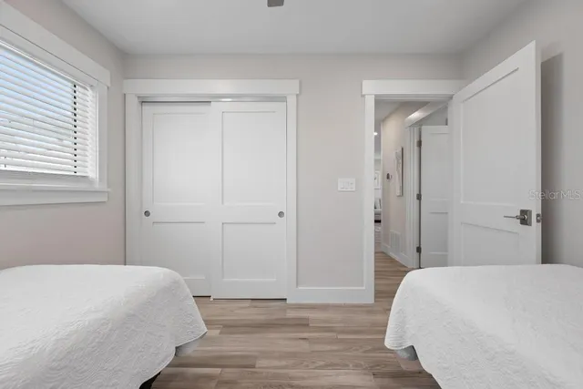 a spacious bathroom with a sink a mirror and a shower