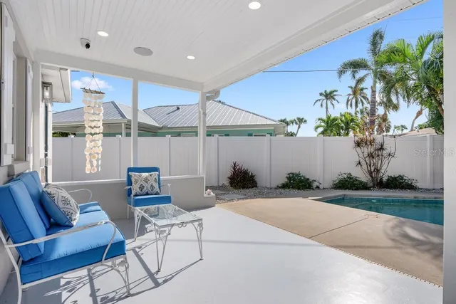 a house view with a sitting space and garden space