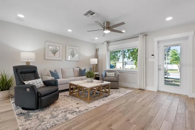 a living room with furniture and a window