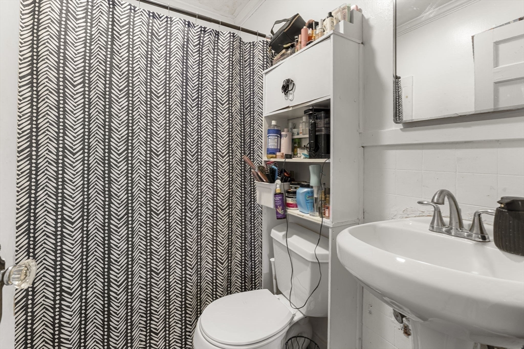275 Bank Street Fall River, MA 02720 - Photo 11 of 20 a bathroom with a sink toilet and shower