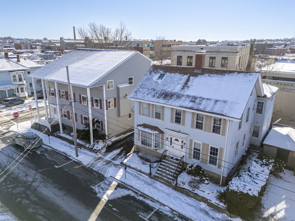 275 Bank Street Fall River, MA 02720 - Photo 18 of 20 a aerial view of a house next to a big yard
