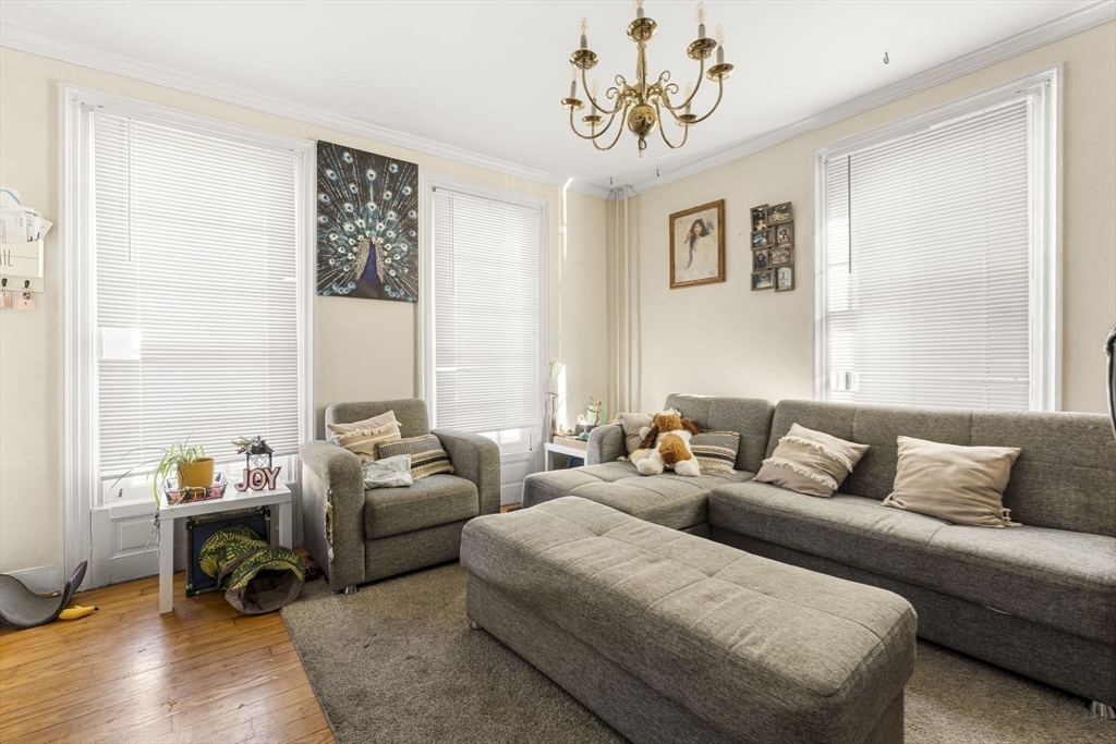 275 Bank Street Fall River, MA 02720 - Photo 5 of 20 a living room with furniture a couch and a window
