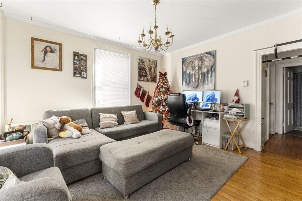 275 Bank Street Fall River, MA 02720 - Photo 6 of 20 a living room with furniture and a chandelier