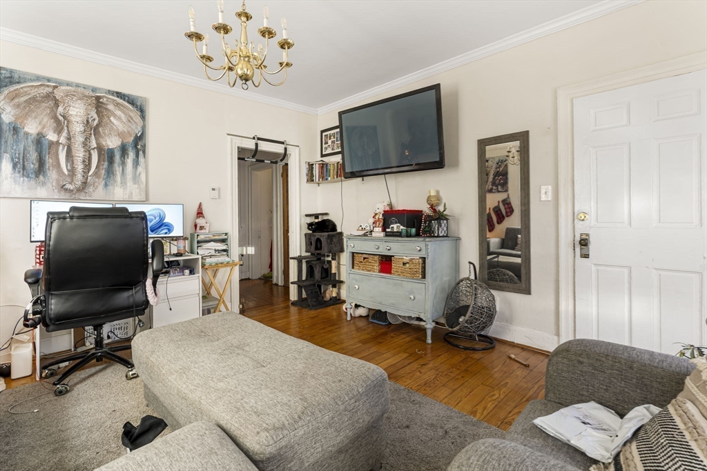 275 Bank Street Fall River, MA 02720 - Photo 7 of 20 a living room with furniture and a flat screen tv
