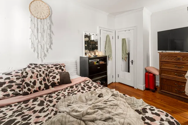 a bedroom with a bed and a television in it
