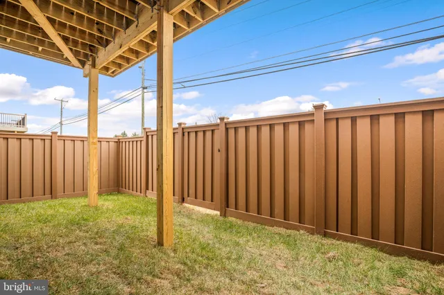 a front view of a building with a garden