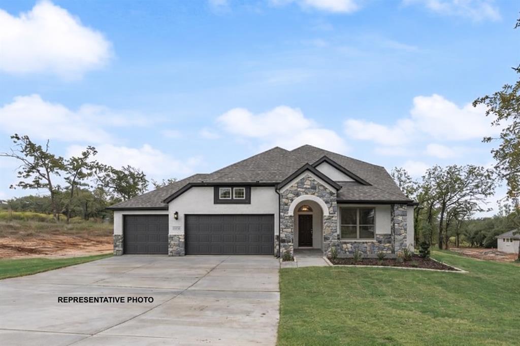 143 Rj Smith Drive Boyd, TX 76023 - Photo 1 of 21 a front view of a house with a garden and yard