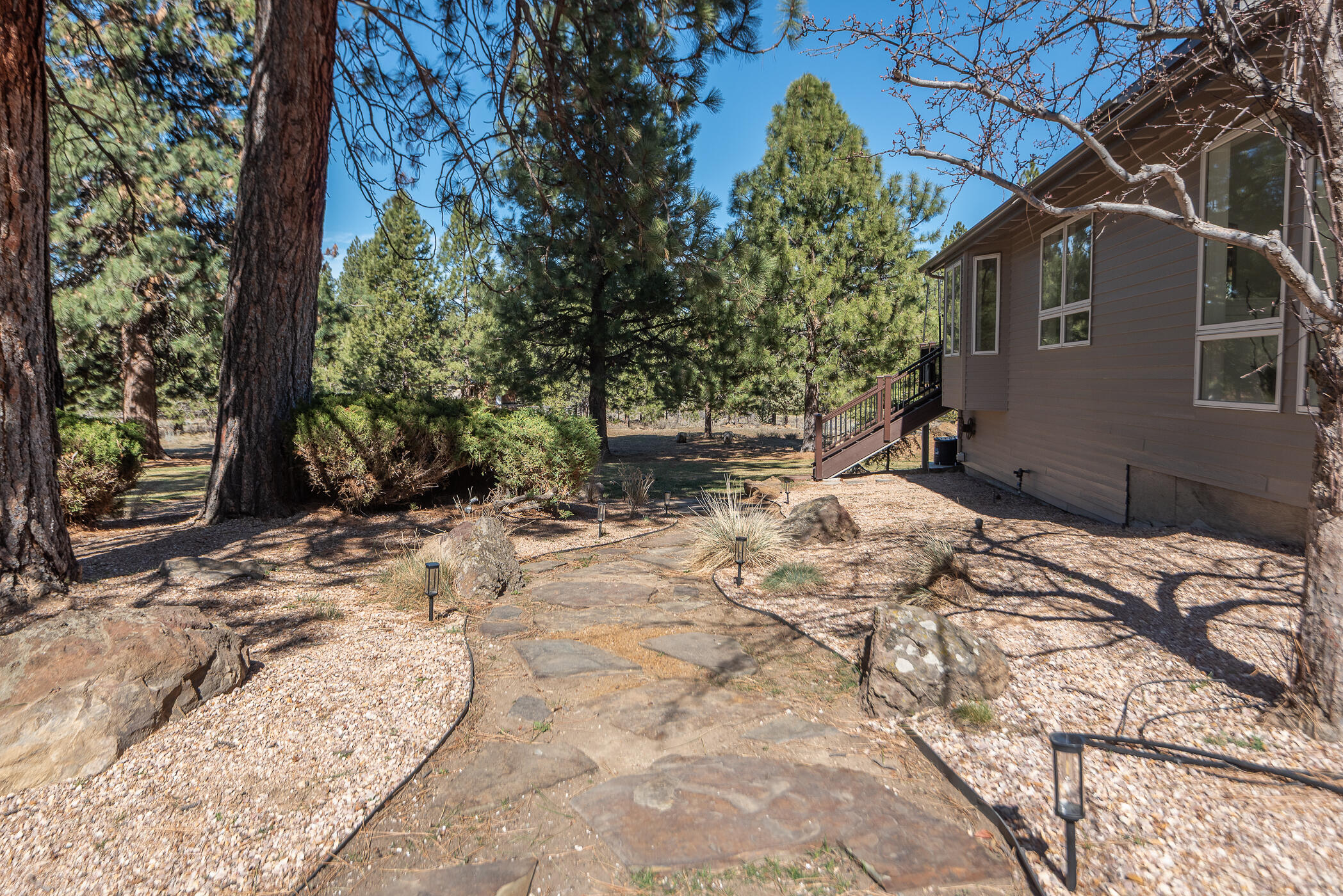 60012 West Ridgeview Drive Bend, OR 97702 - Photo 47 of 55 a backyard of a house with a large tree