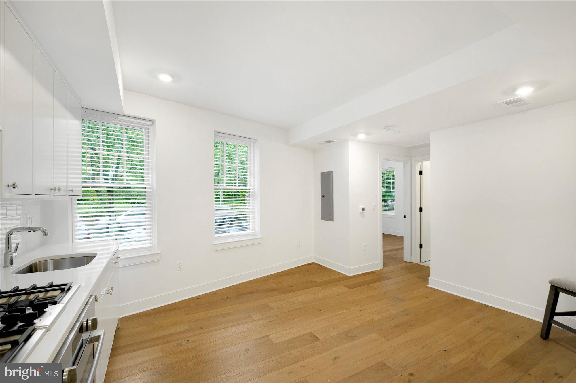 2869 28th Street Northwest, Unit 103 Washington, DC 20008 - Photo 11 of 19 a bedroom with a bed and a window
