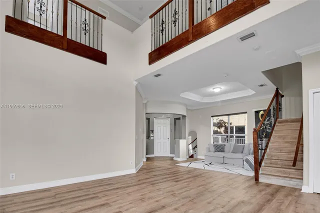 a view of an entryway with wooden floor